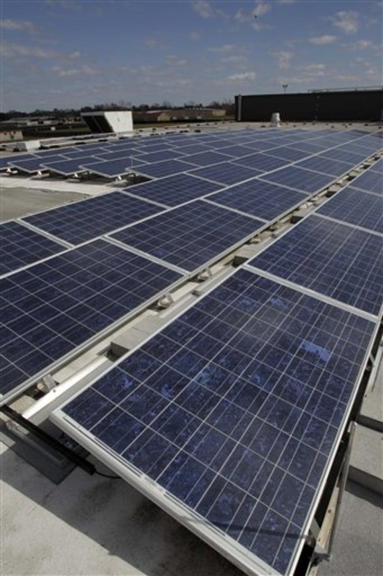 New solar panels are seen on the roof of Sam Rayburn High School  Tuesday, Feb. 15, 2011, in Pasadena, Texas. The panels at Sam Rayburn and another area high schools are expected to save the school district $15,000 annually. (AP Photo/Pat Sullivan)